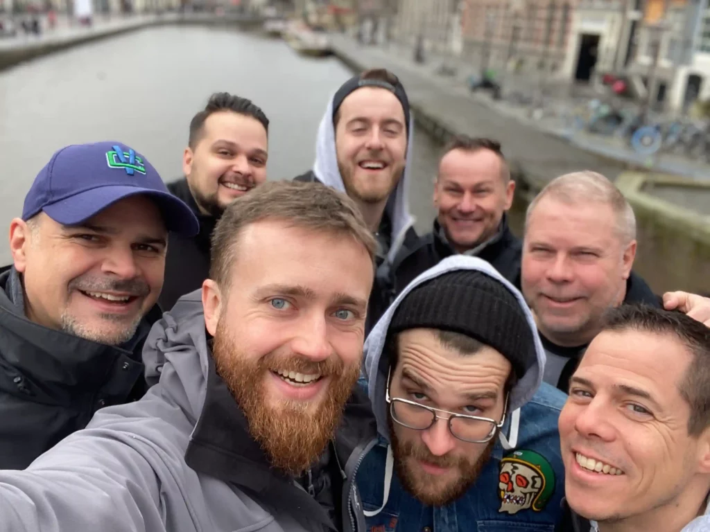 Titan Products Group team enjoying a casual moment by the Amsterdam canal.
