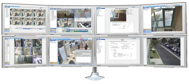 ExacqVision VMS software displayed on six monitors for real-time video surveillance management.